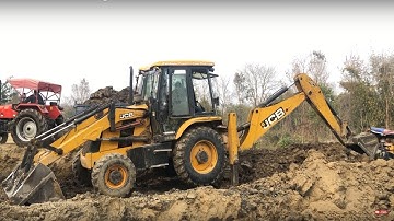 JCB Backhoe 3DX Machine Loading Soil on Tractor