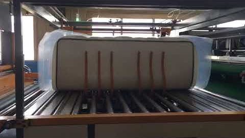 Automatic mattress packing machine film package,compress,fold and roll packing mattress