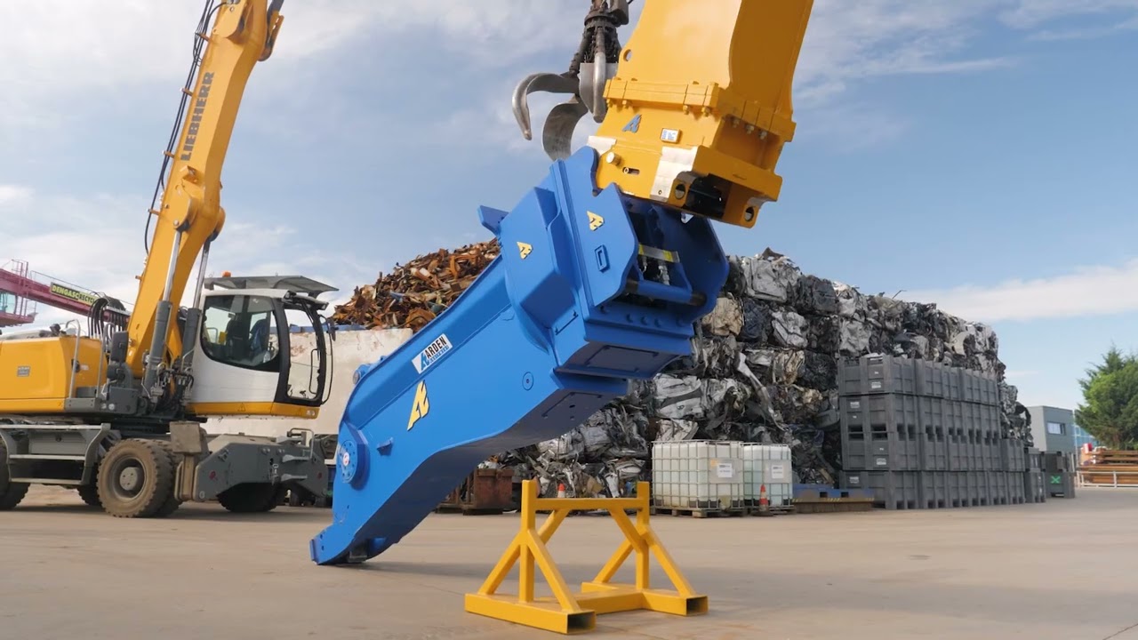 Universal material handler with Arden equipment: a new arm, shears and grab