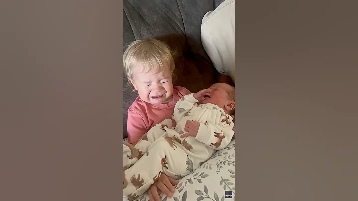 Smiles to sobs: Newborn's cry sets off toddler sibling during first embrace