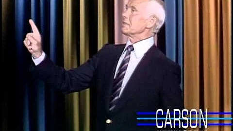 Johnny Carson tries to get through a joke with help from his staff