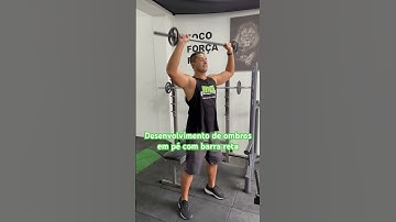 Desenvolvimento de ombros em pé com barra reta