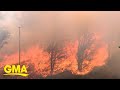 Tens of thousands evacuate as winds fuel more California fires l GMA