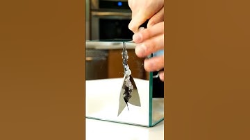 Watch this mind-bending AI-generated video of a cube-shaped mirror being perfectly sliced! 🪞🧊✨