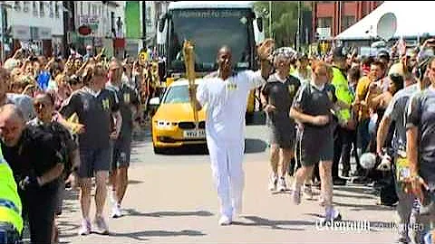 Didier Drogba carries the London 2012 Olympic torch