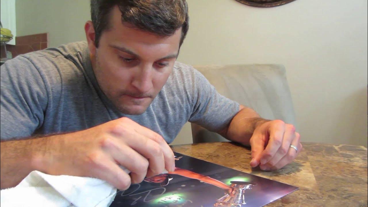 How to remove sharpie or paint pen from autographed photo such as