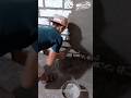 Traditional Manual Mortar Throwing Technique for Brick Wall Finishing.
