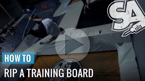 Learn How To Double Cork On A Trampoline With A Training Snowboard