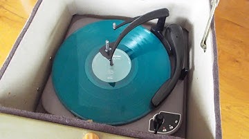 Magnavox Playfellow record player playing a couple LP records.