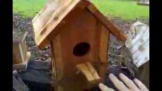Bird houses hand made with thick heavy cedar planks.
