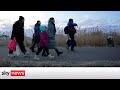 Ukraine Invasion: Queues as thousands cross into Poland for safety