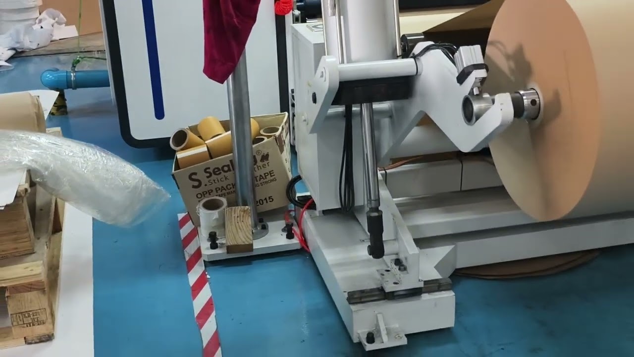 HFQB-1300 slitter rewinder running in Thailand client factory，Rewinding kraft paper with 1inch shaft