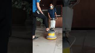 Housekeeping Team Brushing Floor for Re-Opening Hotel
