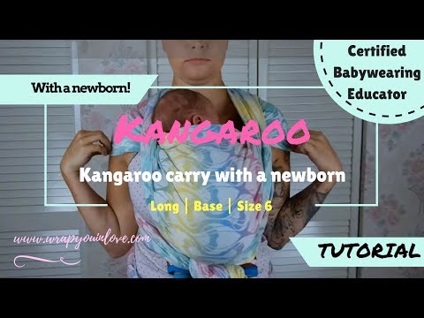Video: How To Wear A Baby In A 