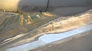 Air Astana take-off from dirt airstrip at Shymkent Airport Kazakhstan