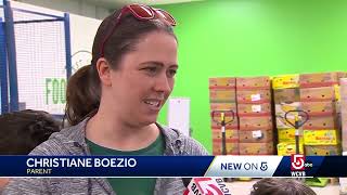 Young volunteers pack boxes for 'Food for Free'