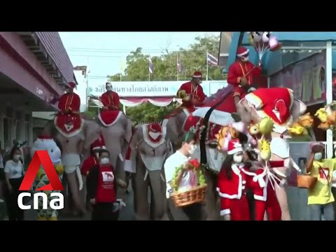 Santas on elephants give out hand sanitisers, face masks to Thai students