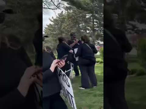 Protesters Lined Up With Signs Ahead Of President Donald Trump S Visit To Michigan