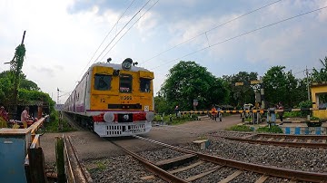 Colorful Speedy Old Emu Local Furiously Passing Busy Railgate : Level Crossing West Bengal