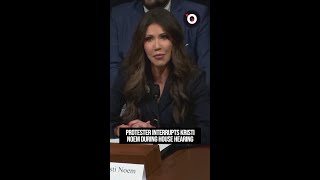 Protester interrupts Kristi Noem during House hearing