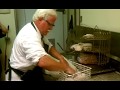 Colonel sanders impersonator making chicken at the clinton kfc