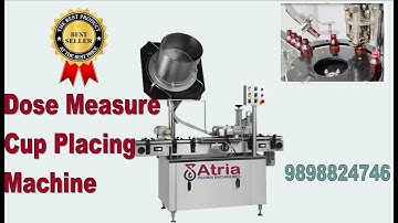DOSE MEASURE CUP PLACING MACHINE In Atria Pharma Machine
