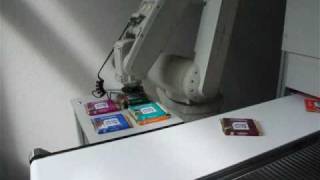 HHN - RV-6SL Robot tracking Ritter Sport chocolate on a conveyor belt with vision system