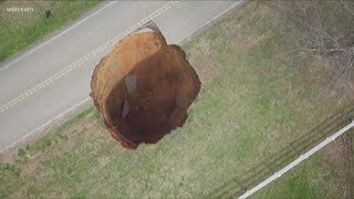 'It's a monster': Giant sinkhole now 60-feet deep