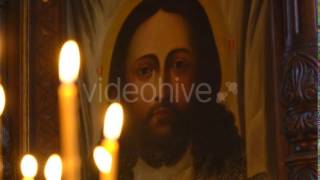 View at the Church From Burning Candles Face of Christ in the Icon. Lick Holy Flame Lit Candles. screenshot 2