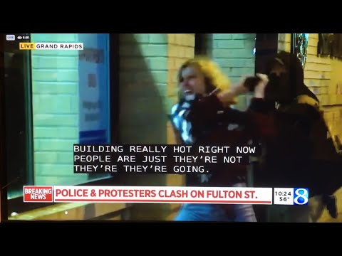 Bat Girl / White rioter in Grand Rapids tries to break window