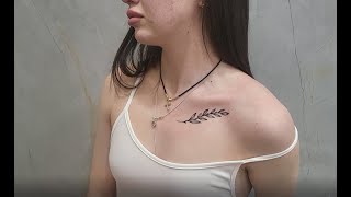 Tattoo above the chest. Women&#39;s beautiful tattoo above the chest