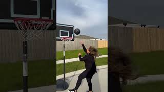 Woman crosses over son then lays basketball into hoop and boy starts to cry