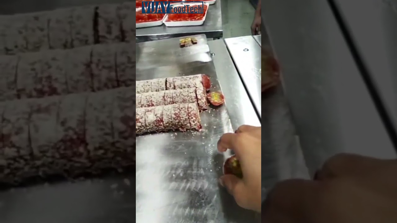 Kaju dryfruit roll cutting machine. Sweet Cutting Machine. 