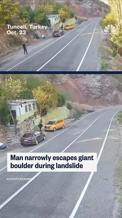 Download lagu Man narrowly escapes giant boulder during landslide