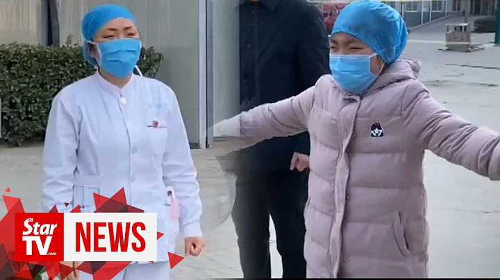 Chinese nurse in coronavirus-hit hospital gives sobbing daughter ‘air hug’ - DayDayNews