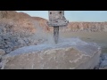 Hydraulic hammer breaking stone slow-motion