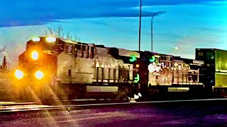 CP stack train with awesome Rumbling ES44AC at front leaving Calgary on the red deer sub. At night.