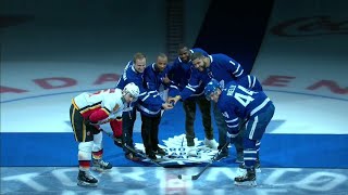 Watch as members of the grey cup champion toronto argonauts drop
ceremonial first puck before maple leafs take on calgary flames.