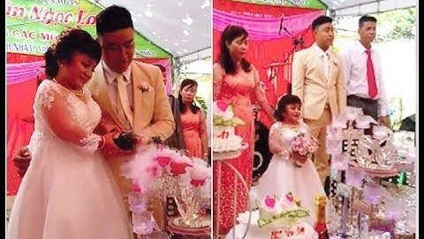 Chú rể cao 1m76 bế bổng cô dâu "nấm lùn" cao chưa đến 1m lên ghế cắt bánh trong tiệc cưới