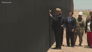 President Trump signs the border wall before heading to Phoenix for a rally