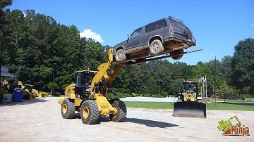 Cat 938M Wheel Loader Lifting SUV With Car Forks