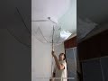 Reuse of old umbrellas in latex paint rolling work