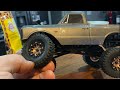 Axial SCX24 C10 mods, wheels, knuckles, diff covers, and shock relocation.