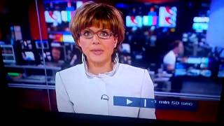 BBC news reporter top button pops open