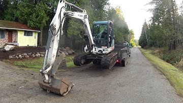 Unloading an excavator from a trailer with No Ramps