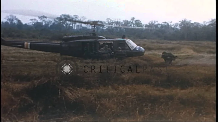 US Army 1st Infantry Division soldiers board UH-1D helicopters during their comba...HD Stock Footage