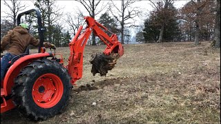 Digging out a stump with a Kubota