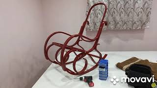 из мусора кресло - качалка. a rocking chair made of garbage.