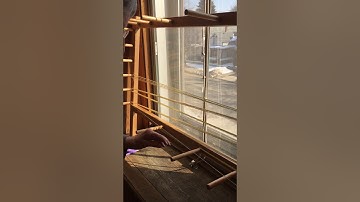 Using a warping board.