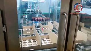 Robot hand picking up milk tea cup cartoning machine coffee bottle encasing line
